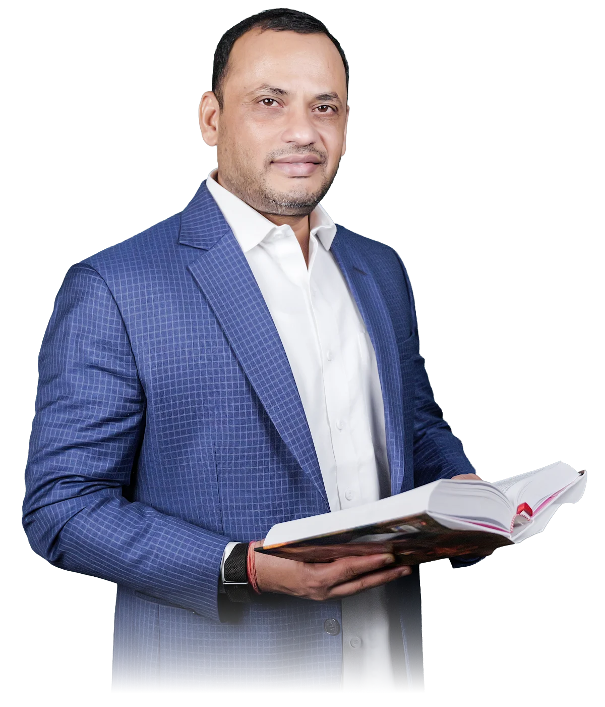 Dilip Auti holding a book, smiling