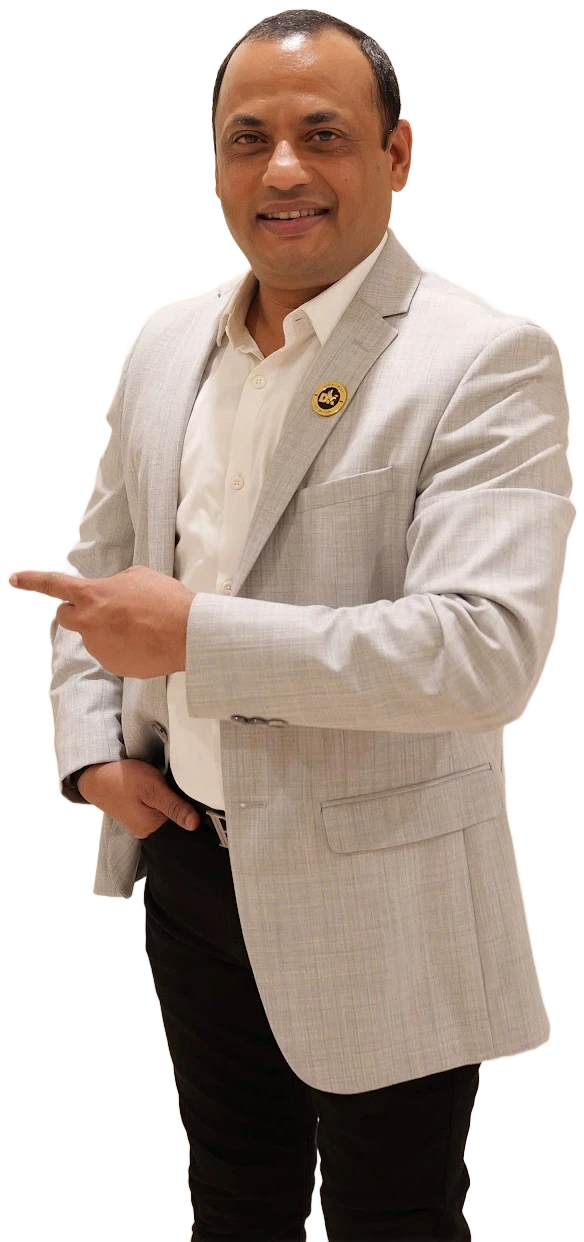 Dilip Auti, business coach and strategist, smiling and pointing