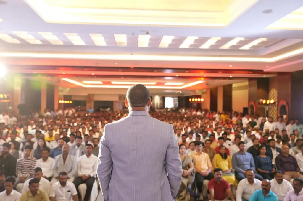 Dilip Auti addressing a full room