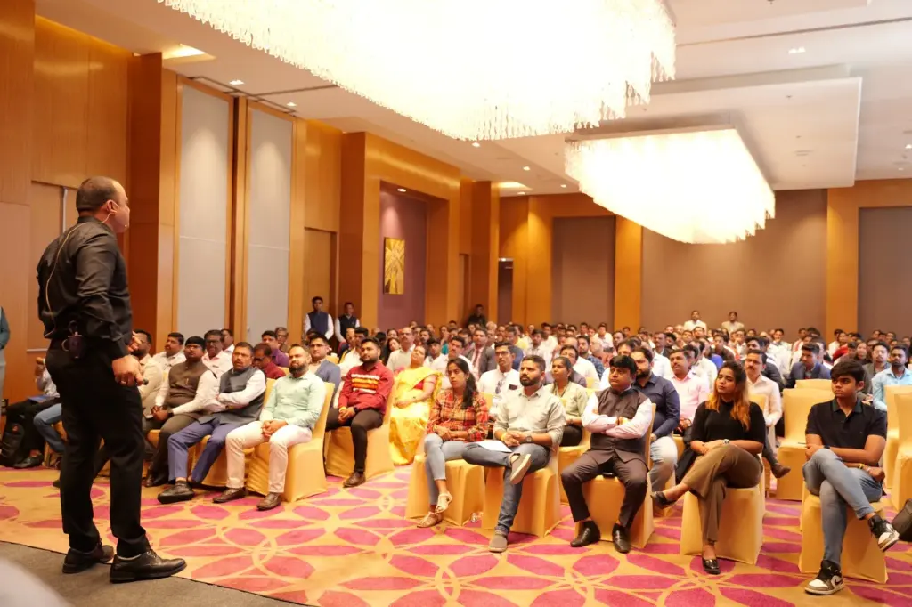 Dilip Auti speaking to owners in a session