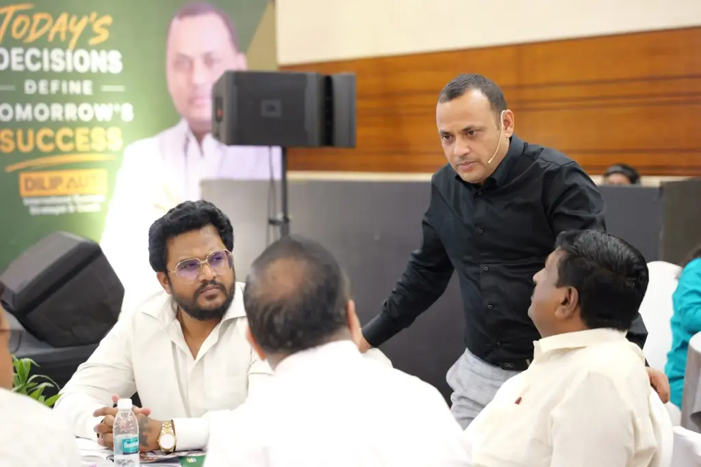 Dilip Auti reviewing a plan with an owner